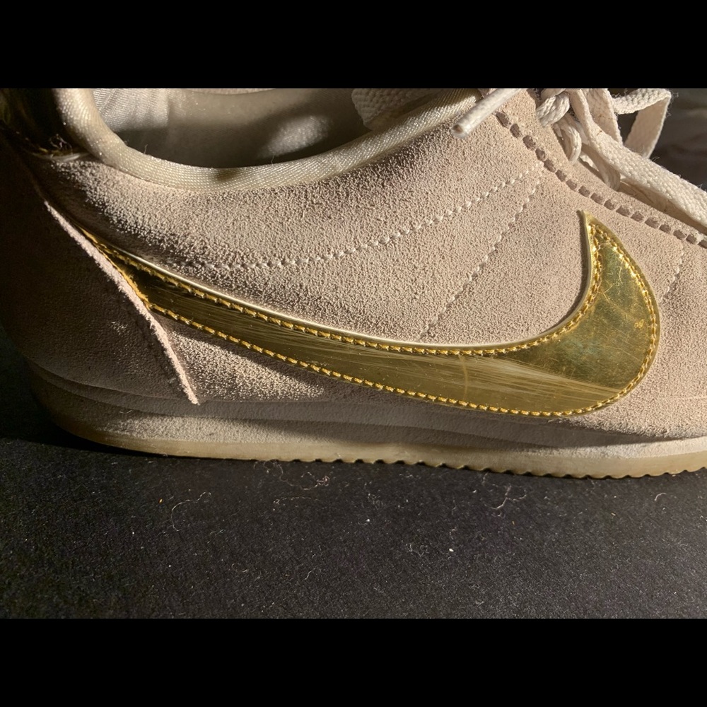 Nike size 9.5 suede with gold metallic swish.